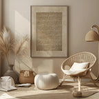 Beige interior with wicker chair, ottoman, and decorative items.