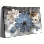 A rectangular wall art canvas showing three stylized flowers against a soft blurred gray background. The center flower is muted blue-gray, with cream and taupe flowers on the left and right.