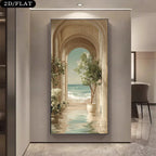 A tall vertical unframed wall art print hangs on a beige hallway wall. The artwork depicts an arched corridor opening onto a seaside scene with pale blue ocean water, white flowers, and potted trees.