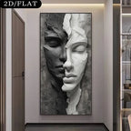 A large vertical wall art print showing a split human face in black, gray, and white sculptural style, displayed in a modern interior hallway. 