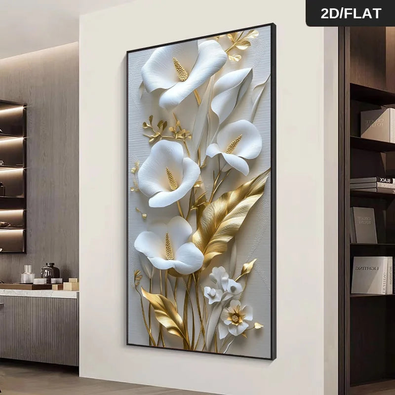 A wall art print featuring a 3D-style floral design with white calla lilies and metallic gold leaves on a light gray background, shown hanging on a white wall in a modern interior setting.