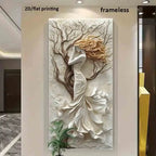 A large vertical wall art piece featuring a sculptural white female figure with flowing golden hair standing before a textured tree, displayed in an interior hallway. Text at the top reads '2D/flat printing' and 'frameless'.