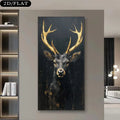 A vertical canvas wall art print depicting a black deer with large golden antlers, shown hanging on a beige wall in a modern living room setting.