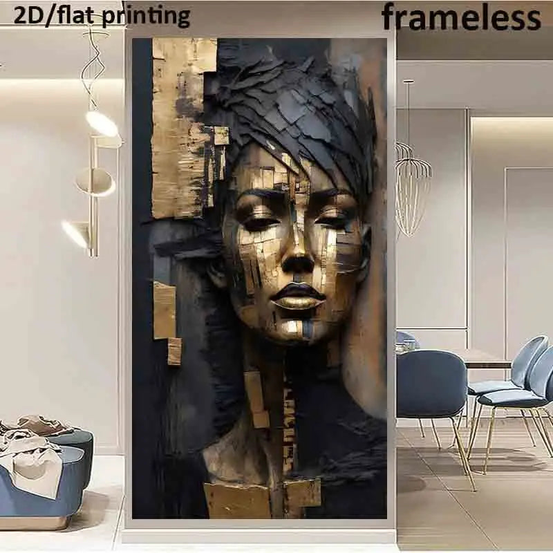 A large vertical wall art print featuring an abstract 3D-style female face in metallic gold and black tones, shown installed in a modern interior hallway with chairs, pendant lights, and text reading '2D/flat printing' and 'frameless'.