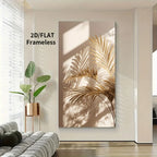 Canvas wall art print featuring golden palm leaves cast in shadow on a beige background, displayed in a modern living room setting next to a gray sofa and a potted plant.