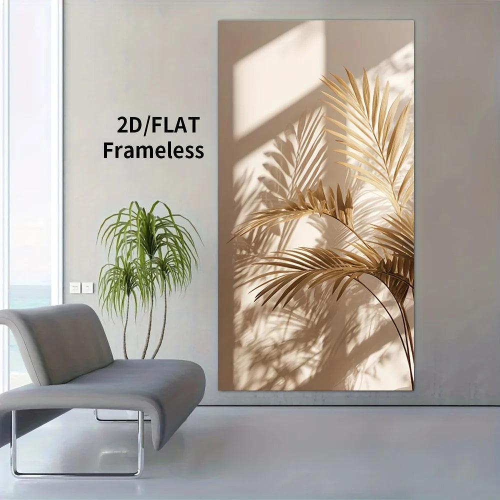 A large vertical wall art print showing stylized golden palm leaves cast in shadow on a warm beige background, displayed in a modern room next to a gray lounge chair and a potted plant.