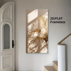 Canvas wall art print featuring golden palm leaves cast with soft shadows on a beige background, displayed on a light gray wall in a modern interior setting next to a white door and staircase.