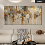 Large abstract wall art hanging above a cream sofa in a modern living room. The artwork features layered floral shapes and vertical brushstroke drips in beige, gold, gray, and white tones.