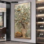 A large wall art piece featuring a 3D textured olive tree with gold olives in a pot, displayed in a modern interior setting.