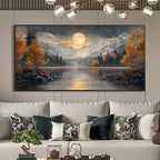 A large rectangular wall art print depicting a moonlit mountain lake landscape with golden trees, is displayed above a white sofa in a modern living room setting.