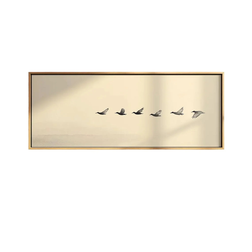 Decorative wall art with five birds in flight on a gold background