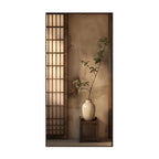 A vertical wall art print depicting a serene Japanese-style interior scene with a beige shoji screen, textured wall, white ceramic vase, and a small wooden stand holding a delicate green plant.