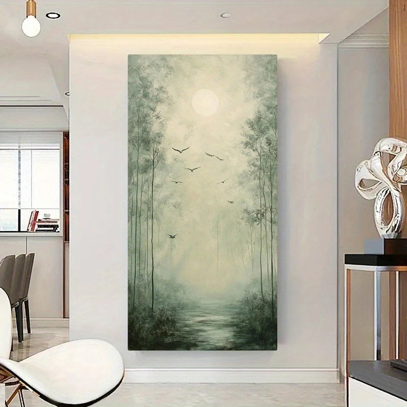 A tall vertical canvas wall art print depicting a misty bamboo forest with a glowing moon and birds, displayed on a light wall in a modern interior setting.