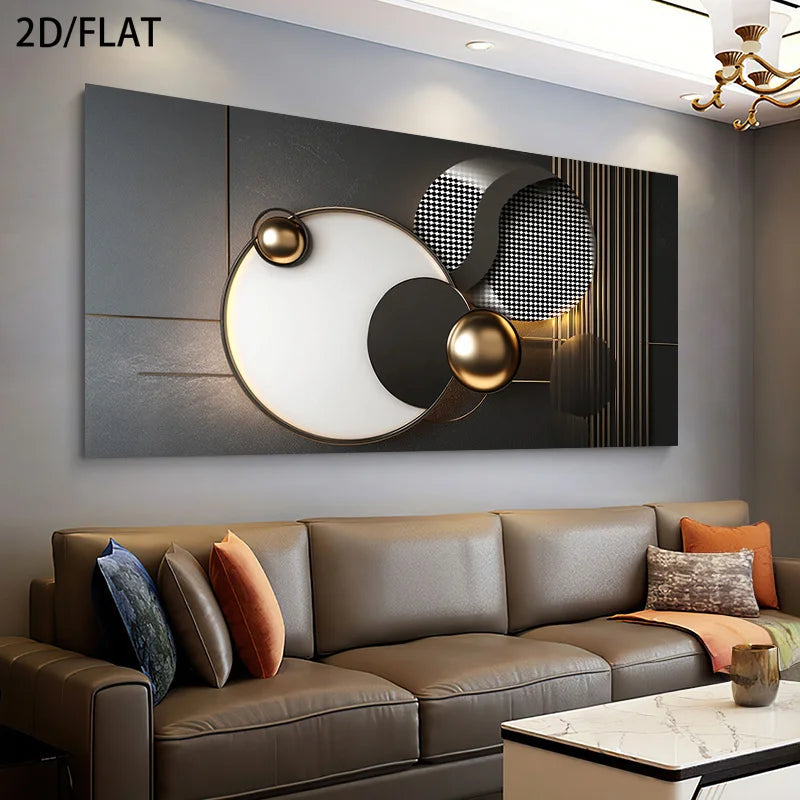 A large rectangular abstract wall art piece with metallic gold, black, gray, and white geometric shapes, displayed above a brown leather sofa in a modern living room setting.