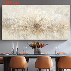 A large abstract canvas wall art piece with a textured radial burst in cream, beige, and brown tones, displayed above a dining table with orange chairs and a floral centerpiece in a modern dining room setting.