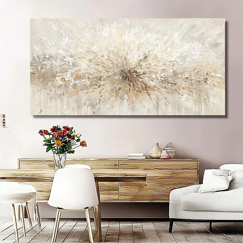 A large rectangular abstract wall art piece with a textured radial burst in cream, beige, and white tones, displayed above a wooden console in a styled living room with white chairs, a sofa, and a vase of flowers.