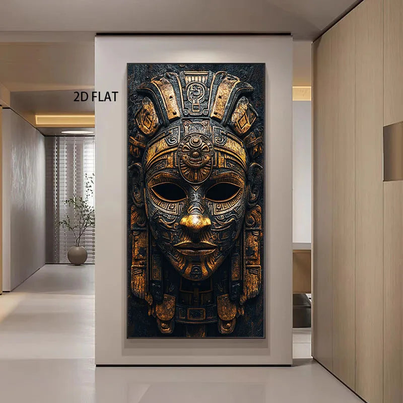 A large vertical wall art print showing an ornate gold and black ancient Aztec-style mask, displayed in a modern hallway with the text '2D FLAT' near the upper left.