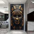 A large vertical wall art print showing an ornate golden Aztec-style mask on a dark background, displayed in a modern living room interior. The text '2D FLAT' appears in the upper left.