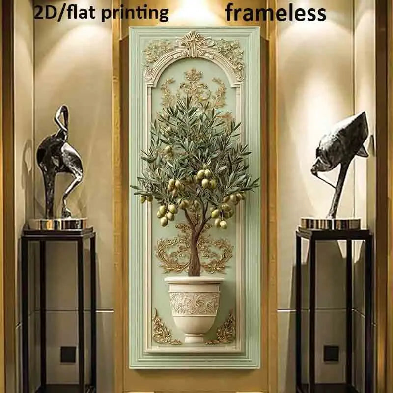 A vertical wall art panel featuring a decorative olive tree in a white pot with gold fruit, mounted in a light green frame. The panel is shown in a hallway setting between two black display stands with bird sculptures, under warm spotlighting.