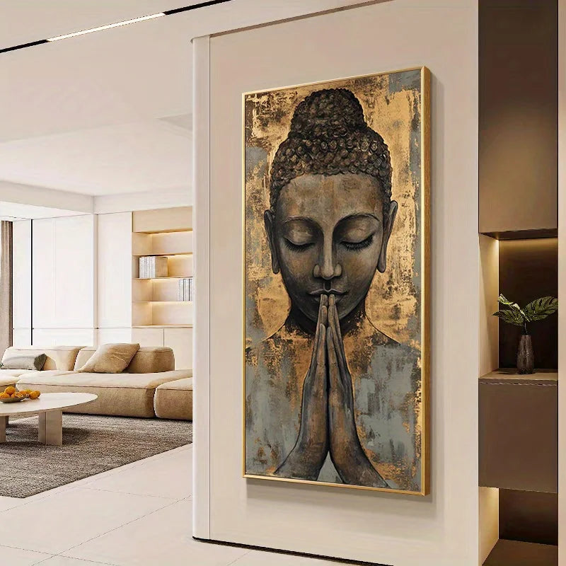 A vertical wall art print featuring a serene Buddha face with hands in prayer, displayed in a modern living room setting.