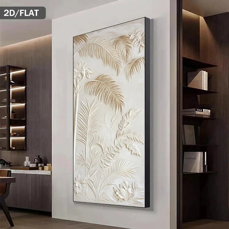 A large vertical framed wall art piece with a raised tropical leaf pattern in warm cream and beige tones, displayed on a light wall in a modern interior setting.