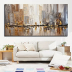 Abstract cityscape painting on a wall above a white sofa in a living room.