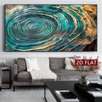 A large wall art piece featuring an abstract turquoise, teal, black, and gold concentric wood-grain or tree-ring style design, displayed above a gray sofa in a modern living room. 