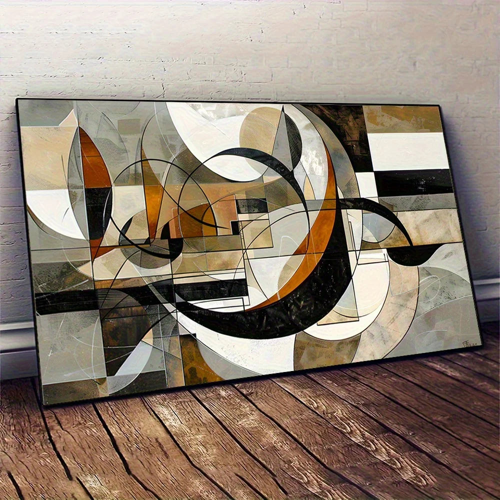 An abstract geometric canvas print with black, white, beige, and brown shapes, leaning against a white brick wall on a dark wood floor.